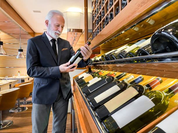 istock A sommelier enjoying a cigar while choosing a wine for tasting in a luxurious restaurant 1215118679