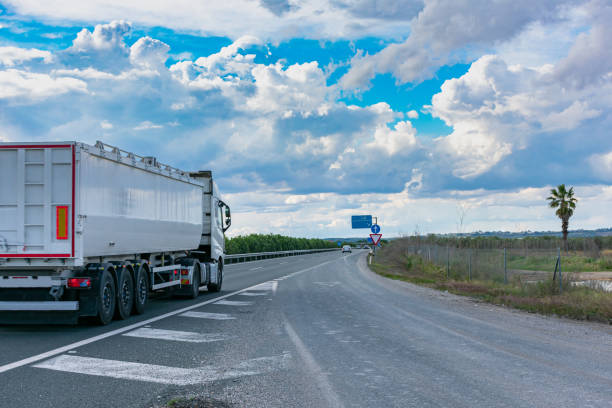 istock Truck with tipper semi-trailer 1215120813