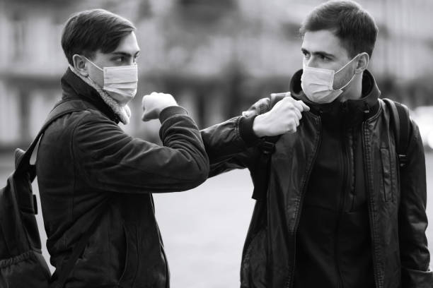 istock Elbow bump is new greeting to avoid the spread of coronavirus. 1215121447