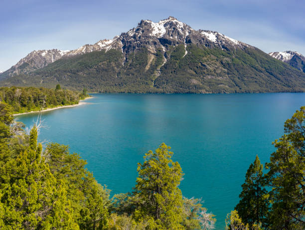 istock Bariloche road by lake, mountain range with snow, Argentina 1215121755