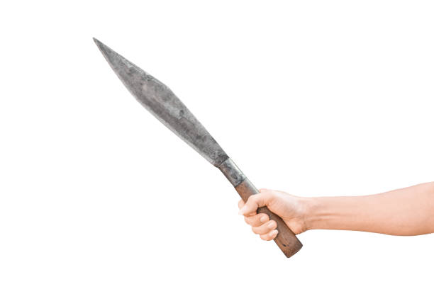 istock hand holding the big knife isolated on white background with clipping path. 1215125959