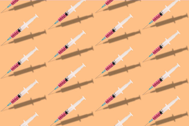 istock Beautiful creative pattern syringe medical on a yellow background. Coronavirus concept, Protect yourself. 1215125967