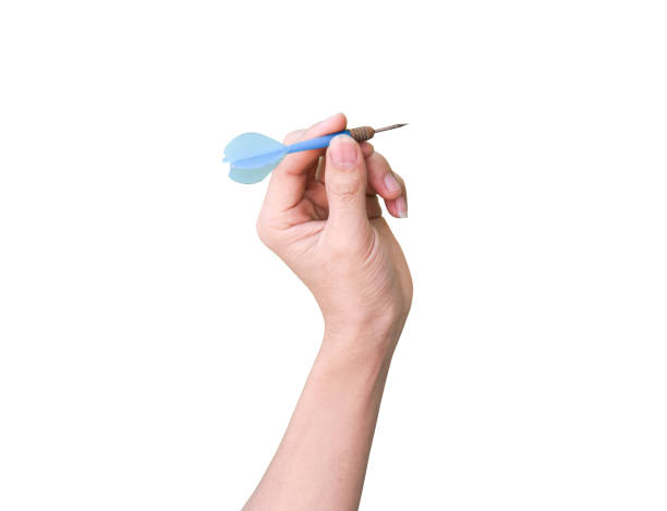 istock male hand holding a darts isolated on white background with clipping path. 1215126008