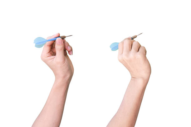 istock male hand holding a darts isolated on white background with clipping path. 1215126183