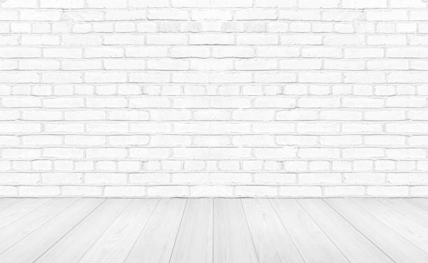 istock Vintage interior room with white wood floor and brick wall background 1215126338