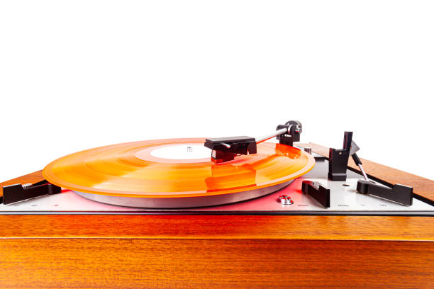 istock Vintage turntable with a red vinyl isolated on white 1215127895