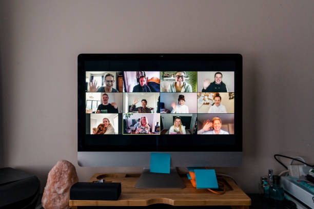 Video Conference Image of a team conference call on a computer screen in a home office. lockdown business stock pictures, royalty-free photos & images