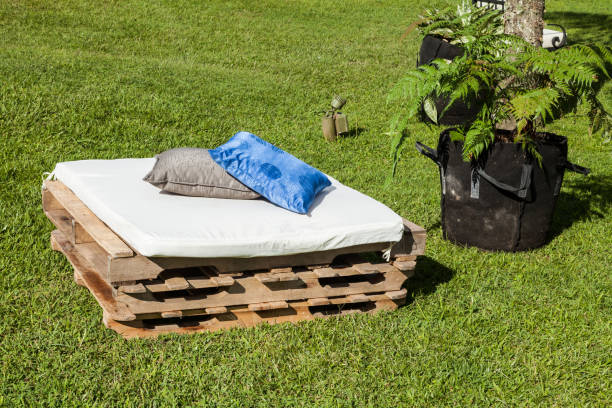 istock Lounge area for guests outside, improvised sofas 1215129712