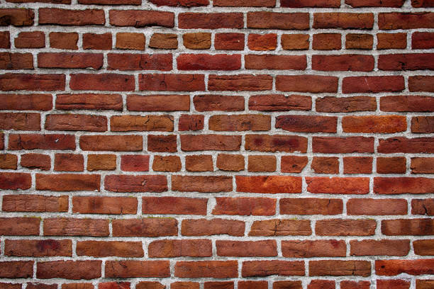 istock Old Red Brick Wall With White Grout 1215130205