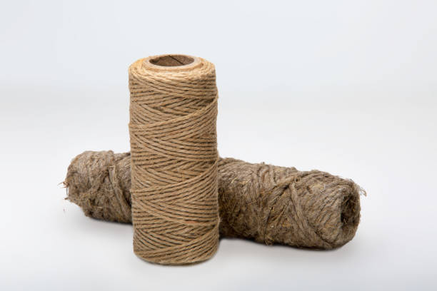 istock two bobbins of decorative thread on a white background 1215132574
