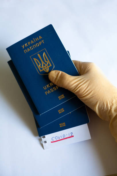 istock Passport and note with Covid-19 inscription. 1215135638