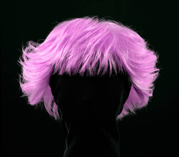 Pink wig pink hair wig isolated on black background fuchsia flower photos stock pictures, royalty-free photos & images