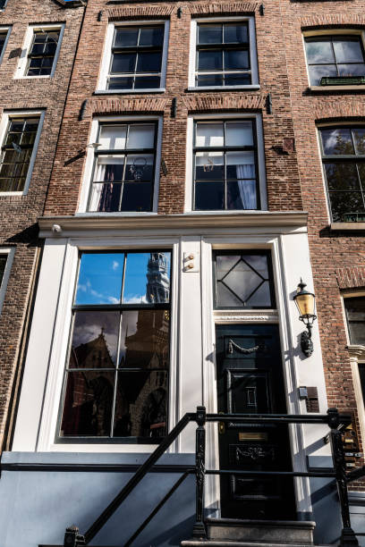 istock Old traditional leaning houses in Amsterdam, Netherlands 1215137524