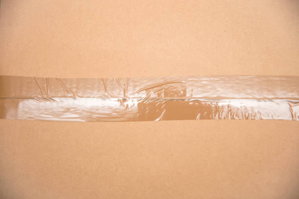istock Card board box sealed with transparent packing tape 1215138752