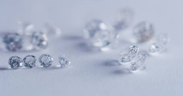 istock Macro close up of experienced goldsmith sorting high quality diamonds 1215141016