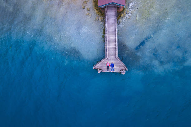 love,affectionate couple lying on the pier, view from above