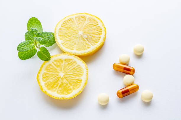 istock Vitamin supplements and fresh lemon 1215141903