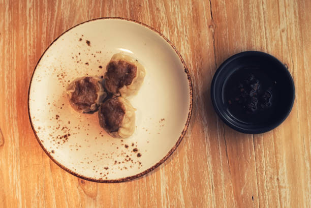 istock Chinese Steamed Dumpling on a traditional plate. 1215142798