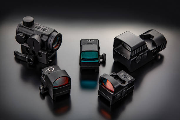 istock Different modern optical collimator sights on dark background. Sights for rifles, carbines and pistols. 1215143063