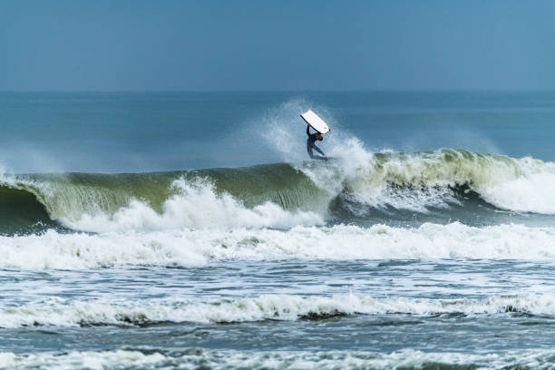 istock Bodyboarder surfing ocean wave 1215145545