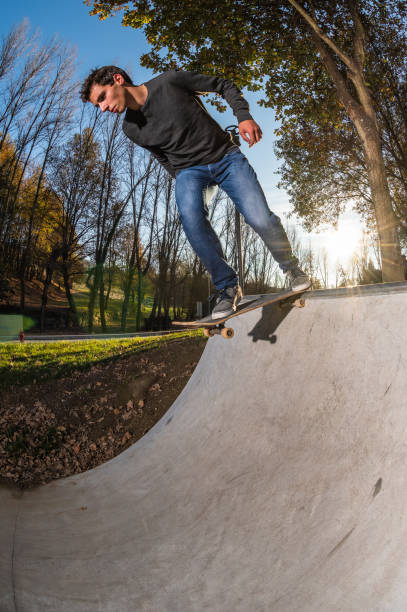 istock Skateboarder dropring a ramp 1215146569