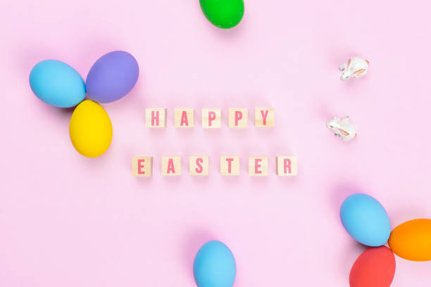 istock Easter day little Bunny rabbit with decorated eggs on pink background 1215148029