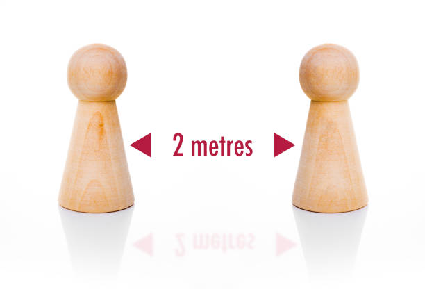 istock Social distancing with wooden pawns  (UK distance) 1215151886