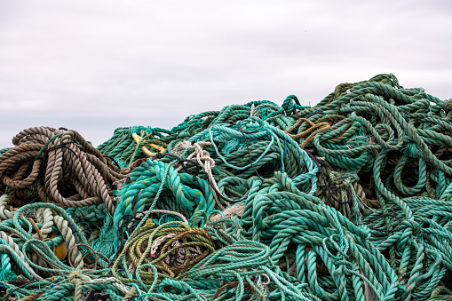 Piles of plastic waste from the fishing industry at the harbor of Djúpivogur, Iceland