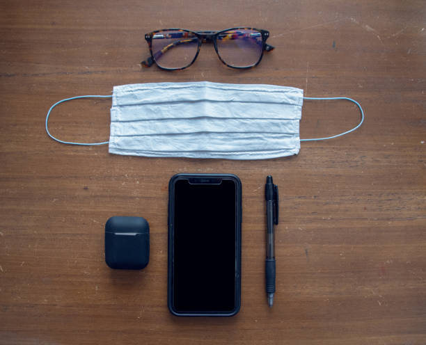 istock Medical mask on a office desk 1215157990
