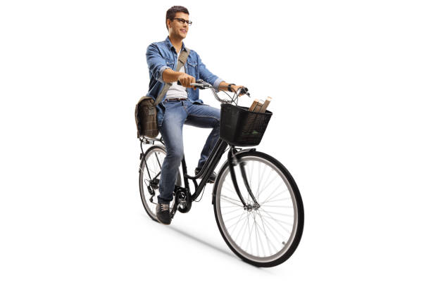 istock Casual guy carrying a bag and riding a bicycle 1215160945
