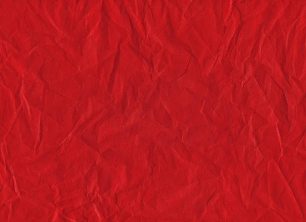 istock red wrinkled paper texture background 1215167284