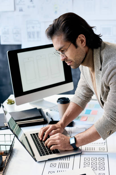 istock Typing on laptop in office 1215170143