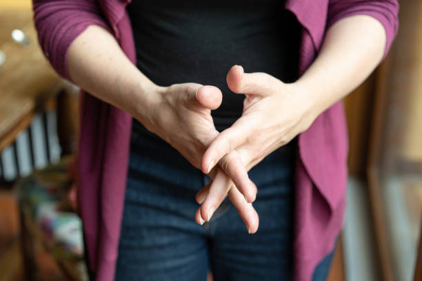 istock Woman cleaning her hand with antibacterial cream 1215170219