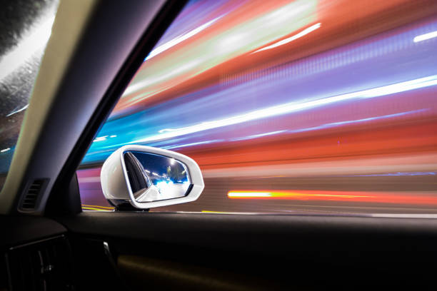 look in wing mirror on an empty highway