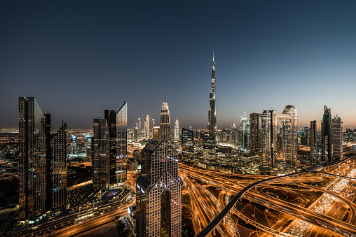 United Arab Emirates, Dubai Skyline, Skyscrapers along Sheikh Zayed Road, Busy with Traffic at Major Intersection, with Burj Khalifa and Financial District.