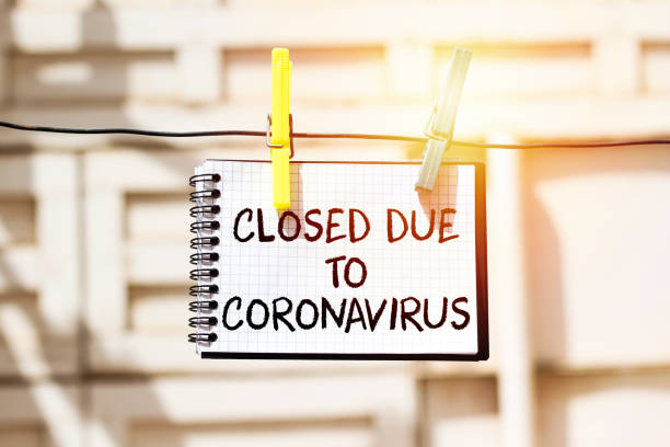 istock hangs notebook with information about the store closing on a shop window due to the coronavirus 1215174891