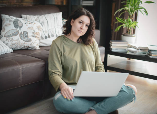 istock Beautiful young woman working at home 1215176022