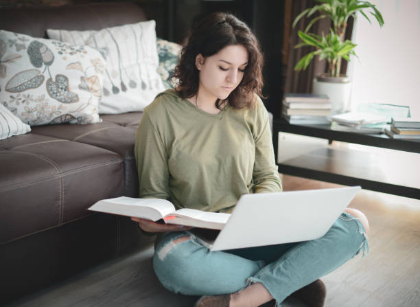 istock Beautiful young woman working at home 1215176496