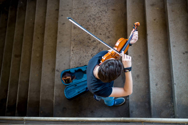 istock Street musician playing violin 1215178712