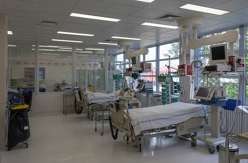 Intensive care unit in hospital, beds with monitors, ventilators, a place where can be  treated patients with pneumonia caused by coronavirus covid 19.