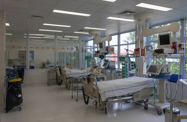 Intensive care unit in hospital, beds with monitors, ventilators, a place where can be  treated patients with pneumonia caused by coronavirus covid 19. Intensive care unit in hospital, beds with monitors, ventilators, a place where can be  treated patients with pneumonia caused by coronavirus covid 19. intensive care unit stock pictures, royalty-free photos & images