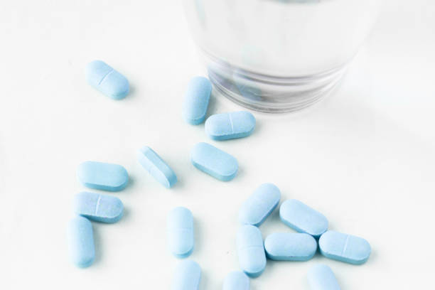 istock medicine pills with water glass 1215181821