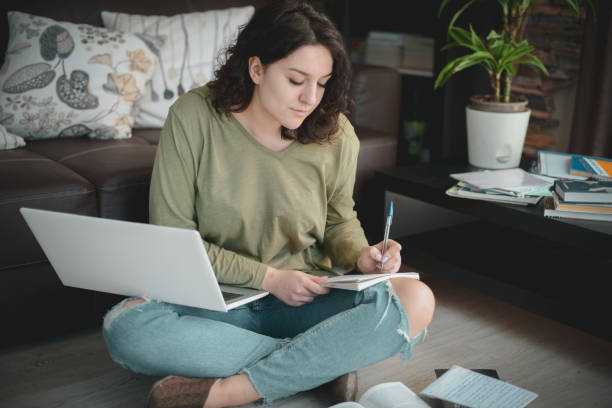 istock Beautiful young woman working at home 1215182192