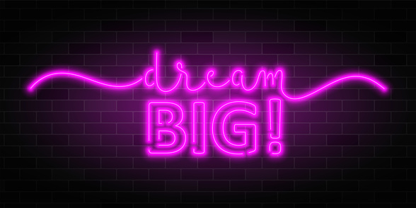 DREAM BIG pink neon vector brush calligraphy banner on brick wall background