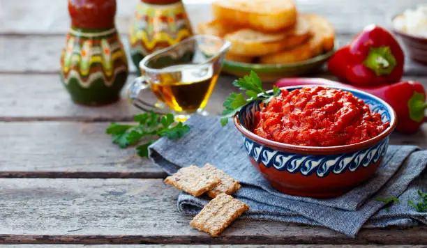 Vegetable relish, chutney, lutenica, pindjur. Traditional Balkan food. Copy space.