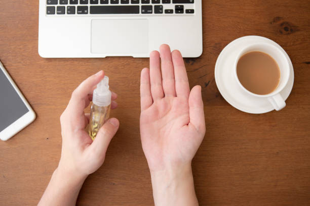 istock Cleaning hand with hand cleaner gel before start to working 1215184983