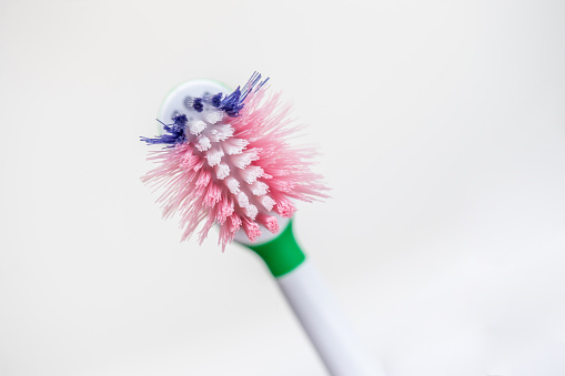 Close-up of Kid's Plastic Toothbrush in Bad Condition.