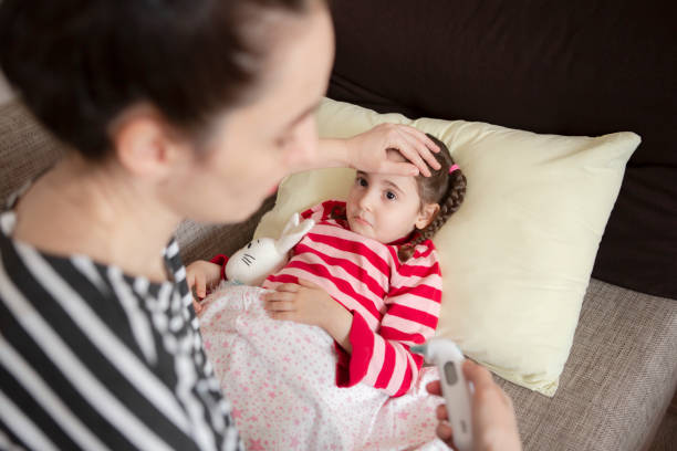 istock Measure Temperature On Sick Child 1215186388