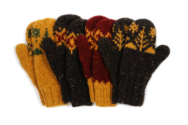 istock Four handmade mittens on a white background. View from above. 1215187313