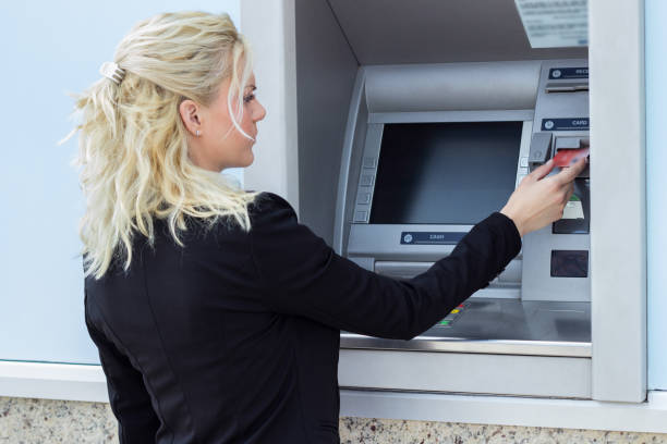 istock Woman using credit card 1215188829